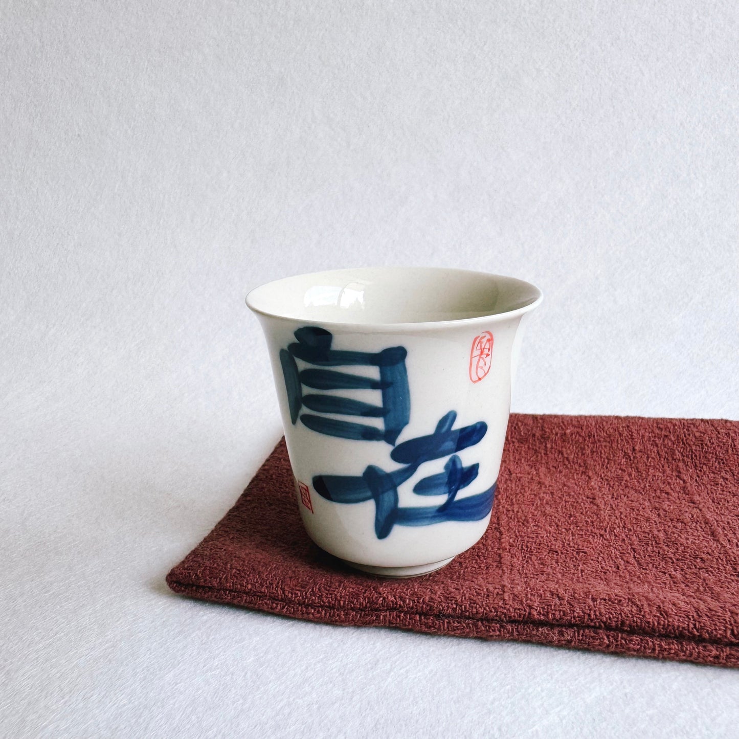 THE CALLIGRAPHY TEACUP "AT EASE"